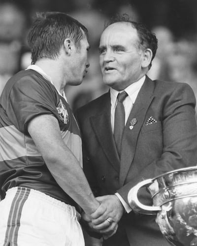 GAA president Michael Loftus with winning captain Páidí Ó Sé of Kerry at the All-Ireland football final in 1985. Photograph: Billy Stickland/Inpho