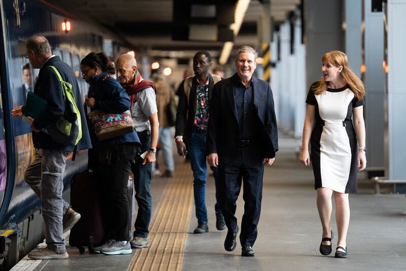 Labour leader Keir Starmer and deputy leader Angela Rayner board a train to Selby, North Yorkshire at King's Cross station in London, to meet newly elected MP Keir Mather after his success in the Selby and Ainsty byelection. Photograph: Stefan Rousseau/PA Wire