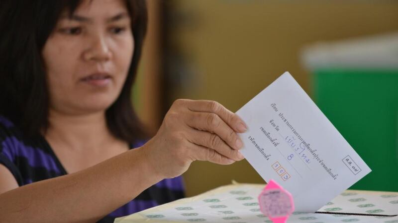 A voter castes a ballot at a polling station during re-run voting in Thailand’s general election today in Samut Sakhon Town, Thailand. The poll re-run was held in five provinces where anti-government protesters disrupted general election voting in the previous month. Photograph: Rufus Cox/Getty Images