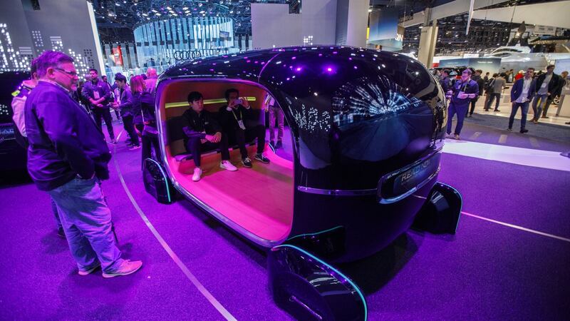 Attendees sit inside a Kia  Motors simulator demonstrating the real-time emotion adaptive driving  system. Photograph: Patrick T Fallon/Bloomberg