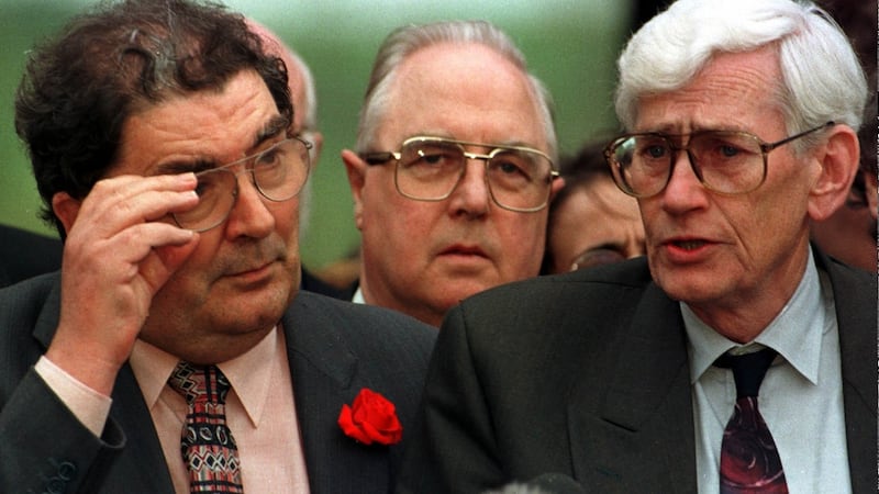 SDLP leader John Hume with his chief negotiator Séamus Mallon facing the media on the day the agreement was signed. Between them is SDLP MP for South Down Eddie McGrady. Photograph: Paul McErlane/AP