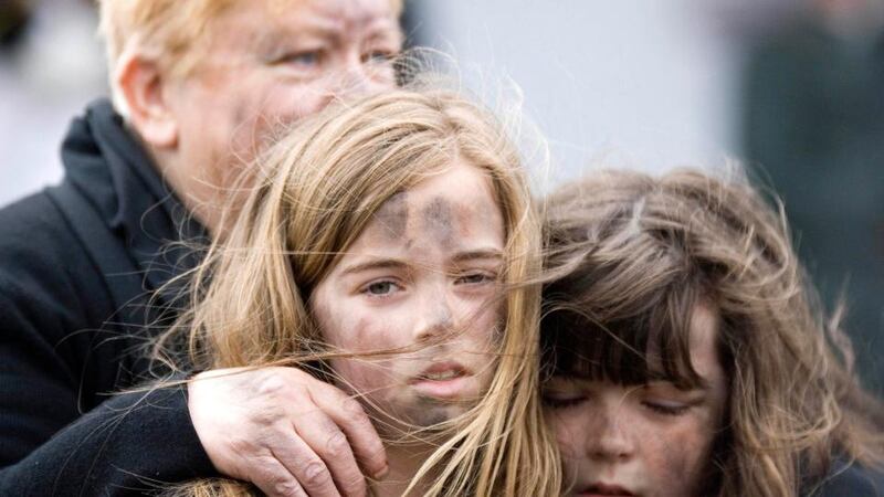 10-year-old Alannah Wade and her sister Teegan (8) from Crack’d Spoon theatre company perform during the Famine Commemoration ceremony in Kilrush. Photograph: Arthur Ellis