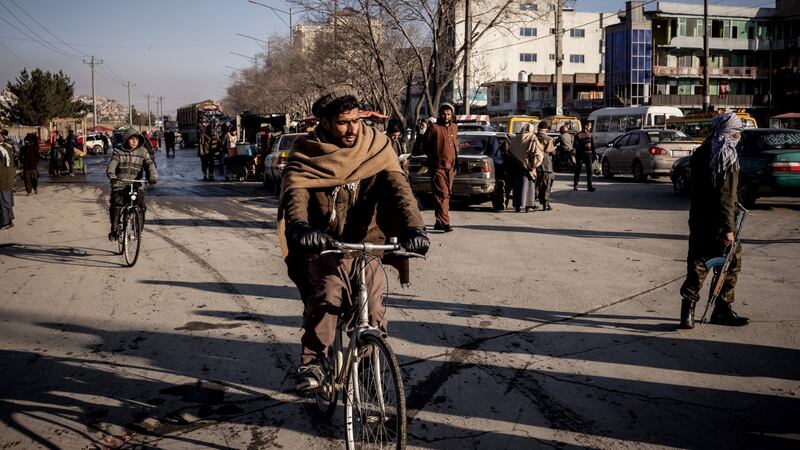 Pedestrian and cyclists in Kabul this week. Photograph: Jim Huylebroek/The New York Times