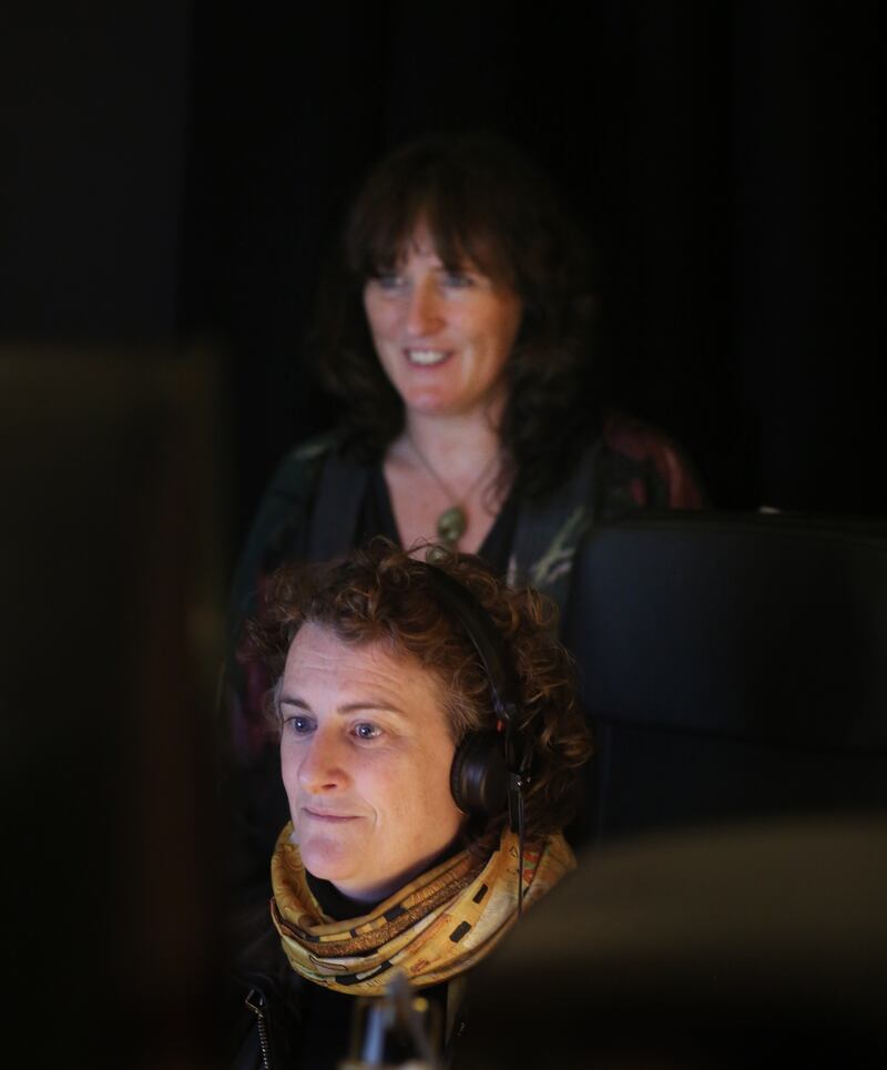  Caoimhe Doyle, (top) at work with Jean McGrath (foreground), at The Foley Lab studios,  in County Wicklow. Photo: Bryan O Brien / The Irish Times 


