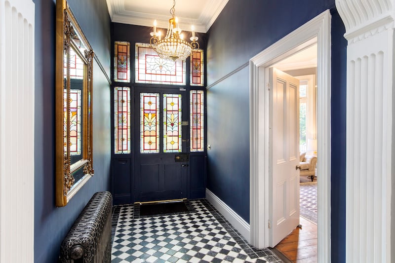 Hallway with original stained-glass panels in door. Photographs: Ronan Melia