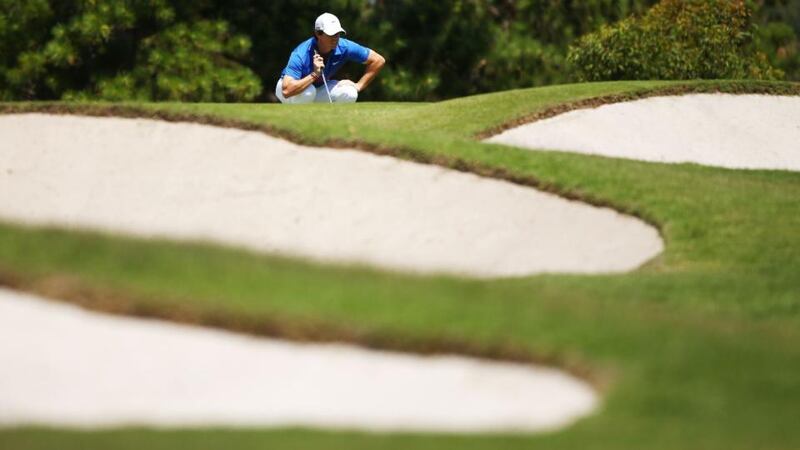 Rory McIlroy lines up a putt on the 8th green during day four of the Australian Open.  Photograph: Matt King/Getty Images)