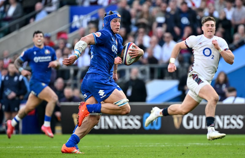 Italy’s Ross Vintcent hares through to score for Italy against England. Photograph: Guiseppe Fama/Inpho