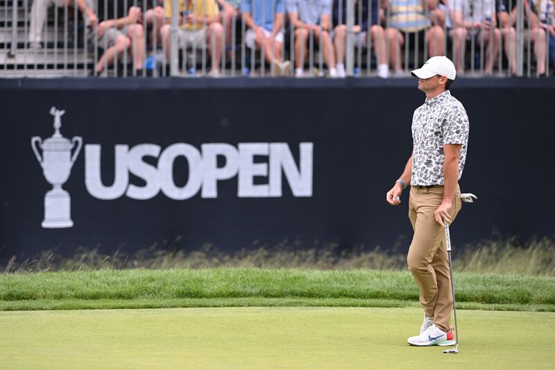 Rory McIlroy reacts after missing his putt for par on the ninth green, his 18th, during round one of the US Open. Photograph: Ross Kinnaird/Getty Images