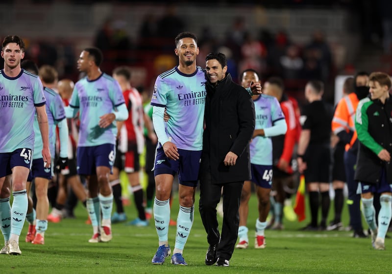 Arsenal manager Mikel Arteta celebrates with William Saliba after beating Brentford 3-1 at the Gtech Community Stadium. Photograph: Steven Paston/PA