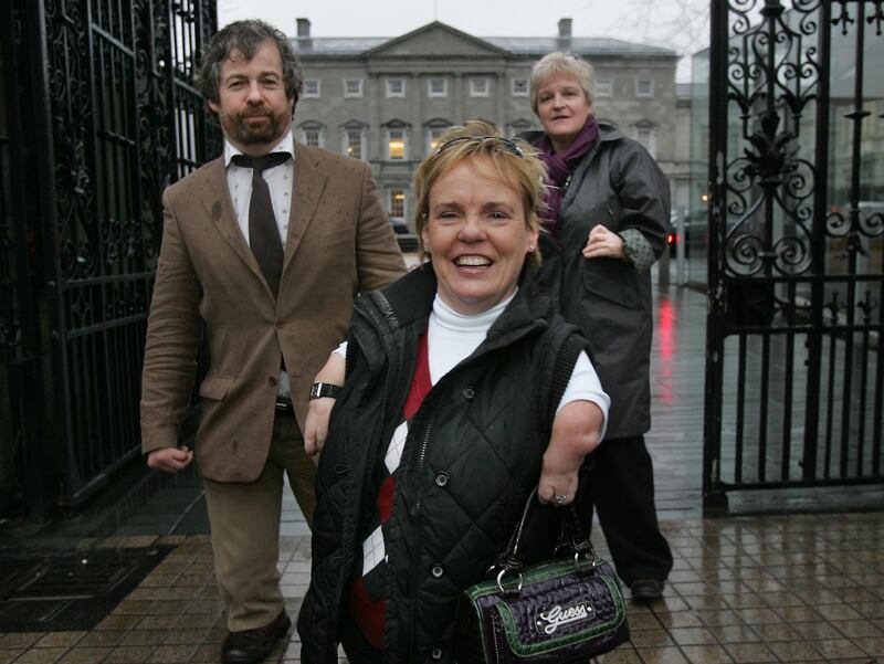 Representatives of the Irish Thalidomide Association, Dr Austin O'Carroll. Maggie Woods, centre, and Finola Cassidy, arrive for a Joint Oireachtas Committee meeting on health and children in Leinster House in 2010. Photograph: Matt Kavanagh     