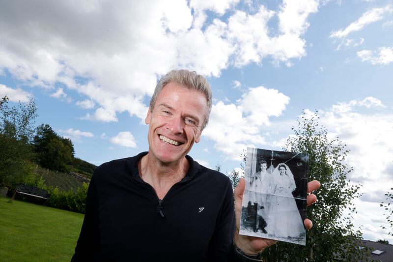 Former Olympian Shane Healy holding a picture of his parents Bernard and Maureen Healy  on their wedding day in 1958. He lives in Ravensdale, Co. Louth has been searching for his mum and sister since they walked out of the house 50 years ago, when he was just four. Photograph: Alan Betson / The Irish Times

