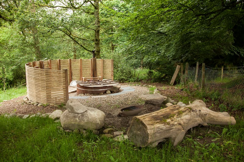 There is a hot tub hidden in the woodlands