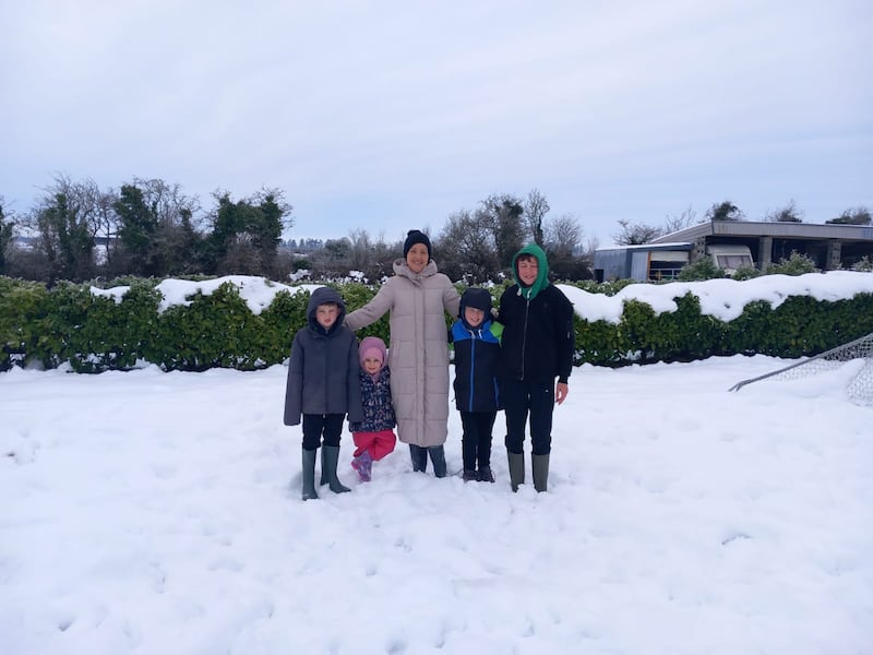 Limerick mother Lynda O'Dwyer with her four children outside their home in Ballyagrad where they have been without electricity for four days.