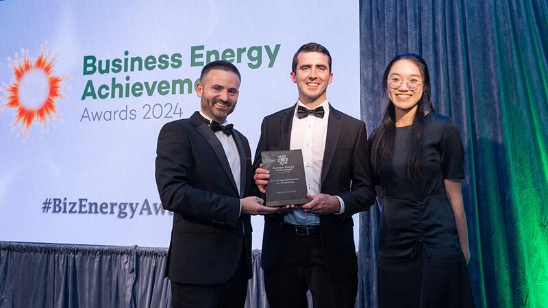 James Carton, awards judge, presents the best energy achievement in life sciences award to Brendan Keohane and Rindy Sim, Gilead Sciences Ireland