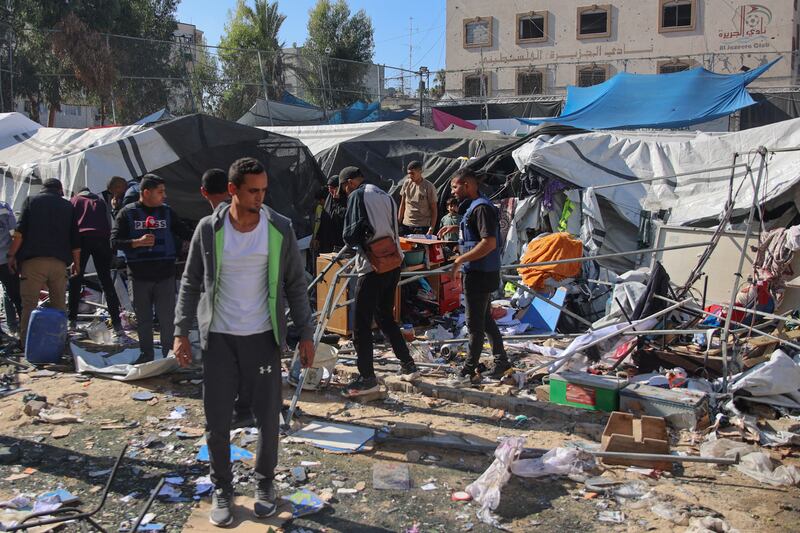 Palestinians inspecting the damage following an  Israeli bombardment which hit a camp for displaced people inside the Al-Jazira Sports Club in Gaza City on November 12th, 2024. Photograph: Omar Al-Qattaa/AFP