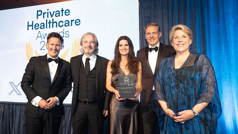 Shay Dalton, managing partner of Medforce, presents the private hospital of the year award to the Mater Private Network Team.