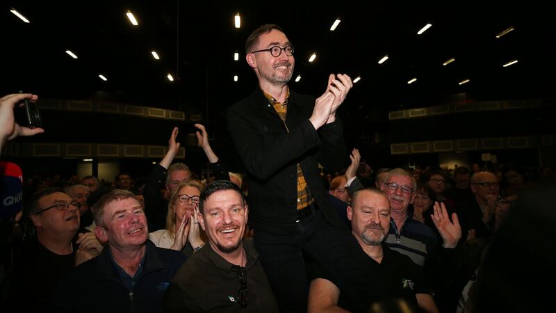 Sinn Féin’s Eoin Ó Broin  celebrating with colleagues and family after being elected in Dublin Mid West. Carrying him aloft, to his left, is fellow candidate Mark Ward, who has also been elected in the constituency. Photograph: Nick Bradshaw