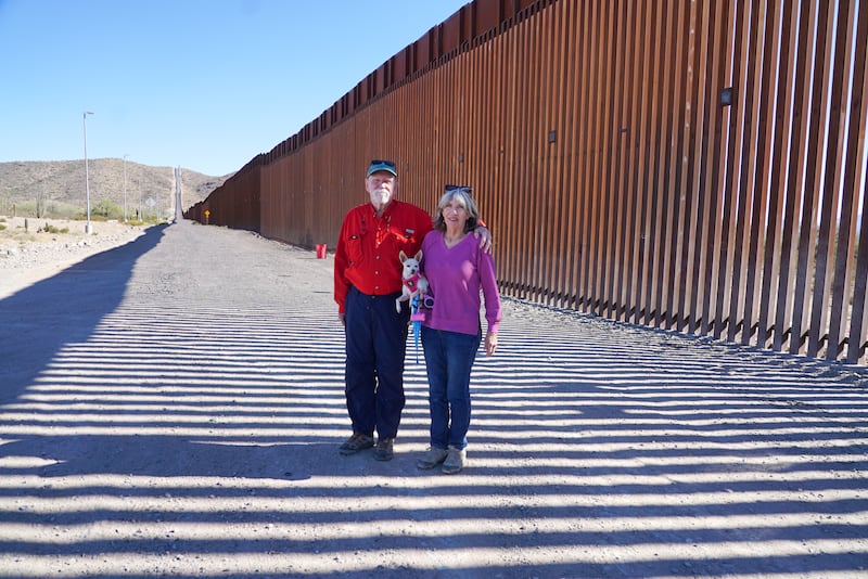 Tom and Carol Wingo and their dog Daisy at the the US/Mexico border wall. Photograph: Enda O'Dowd