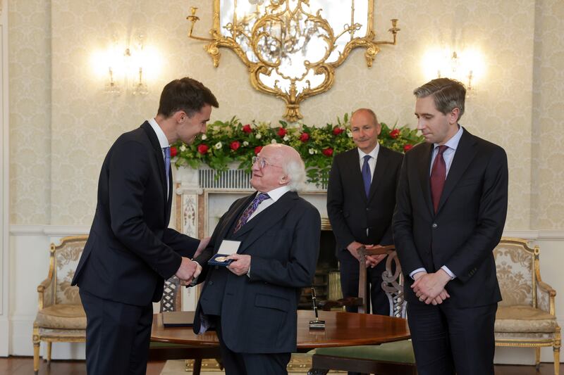 Minister for Finance Jack Chambers receiving his seal of office from President Michael D Higgins with  Simon Harris and Micheál Martin. Photograph: Tony Maxwell/PA Wire 