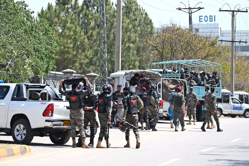 Rangers cordon off the High Court for the arrival of Pakistan's former prime minister Imran Khan in Islamabad on Friday. Photograph: Farooq Naeem/AFP/Getty Images