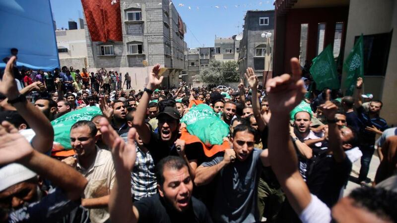 Mourners carry the bodies of Palestinian members of al-Haj family, who medics said were killed in an early morning air strike that destroyed at least two homes, during their funeral in Khan Younis, in the southern Gaza Strip. Photograph: Ibraheem Abu Mustafa/Reuters