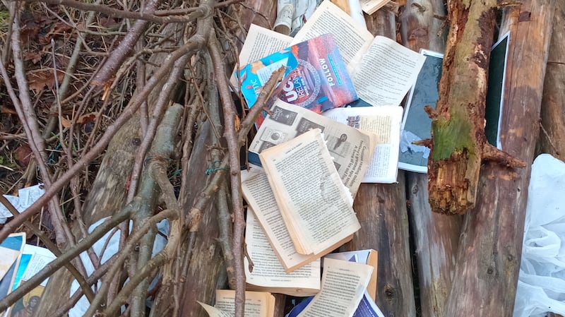 Torn books, rosary beads and religious statues were dumped with canes and poles removed from the community garden