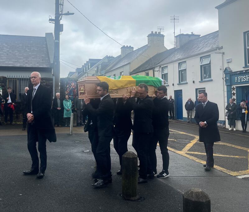 Micheál Ó Muircheartaigh’s coffin is brought into St Mary’s Church, Dingle, by his sons and grandsons.