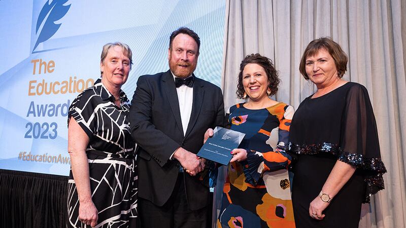 Declan Allen, awards judge, presents the Best Further Education Provider award to Drogheda Institute of Further Education team 