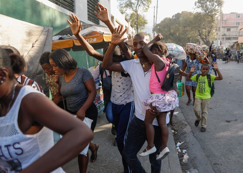 Residents flee their homes during clashes between police and gang members in the Portail neighbourhood in Port-au-Prince, Haiti. Photograph: Odelyn Joseph/AP