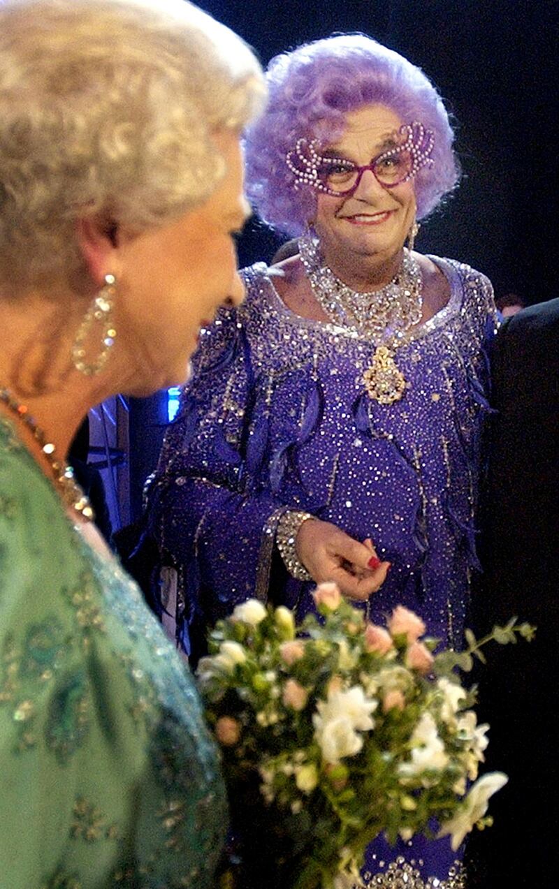 Queen Elizabeth II meeting Barry Humphries aka Dame Edna Everage in 2003 at the Festival Theatre in Edinburgh. Photograph: David Cheskin/PA