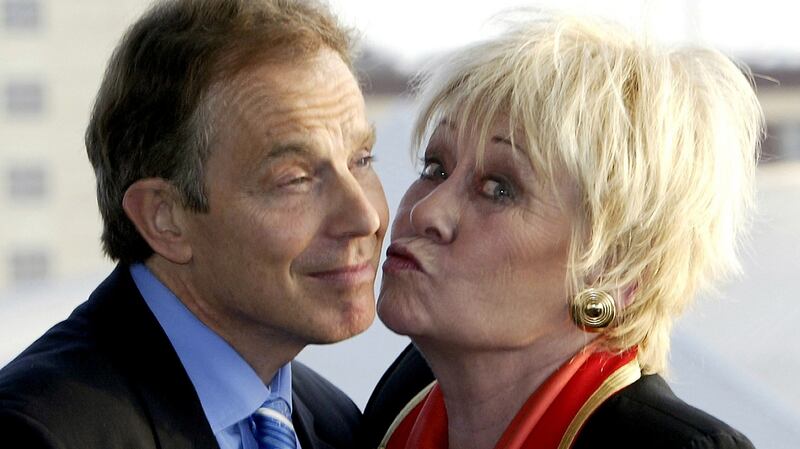 Former prime minister Tony Blair accepts a kiss from Dawn. Photograph: Reuters