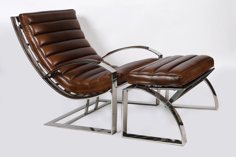 Modern leather and chrome armchair with concave ribbed seat, €2500-€3,500