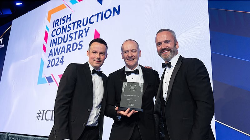 Paul Byrne, sales director at Tech Refrigeration and Air Conditioning, presents the engineering firm of the year award to David Brennan and James Park, Eastgate Engineering