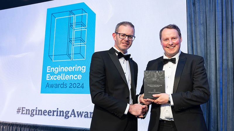 Niall Hanley, awards judge, presents the manufacturing engineering project of the year award to Ryan Loney, Red Engineering Design