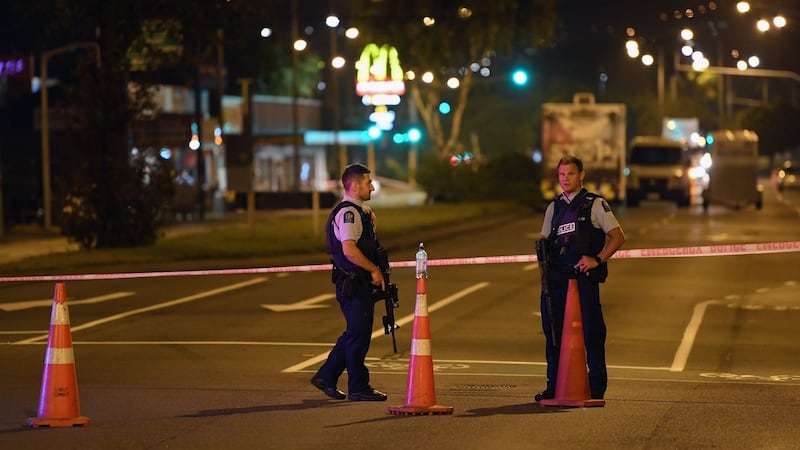 Police cordon off Linwood Avenue near the Linwood Masjid mosque. Photograph:  Kai Schwoerer/Getty Images