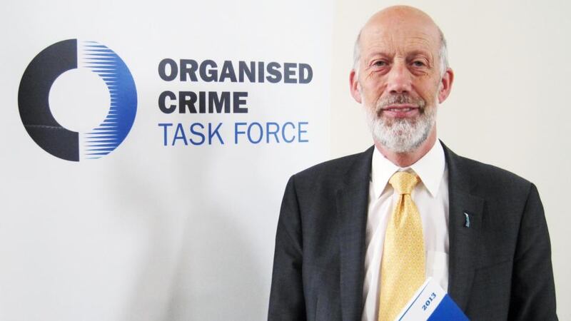 Northern Ireland Justice Minister David Ford with the Organised Crime Task Force annual report. Photograph: Lesley-Anne McKeown/PA Wire