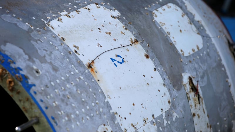 The pockmarked 75 kg (165 lb) half-cylinder, almost 2m long and 1m wide, is thought tohave  come from a long-range, three-stage rocket fired by North Korea on February 7th that flew over Japan’s southwest Okinawa island chain. Photograph: Toru Hanai/Reuters