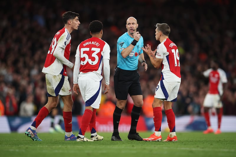 Referee Anthony Taylor disallows a goal scored by Kai Havertz as team-mates Ethan Nwaneri and Leandro Trossard react  to his decision. Photograph: Alex Pantling/Getty Images