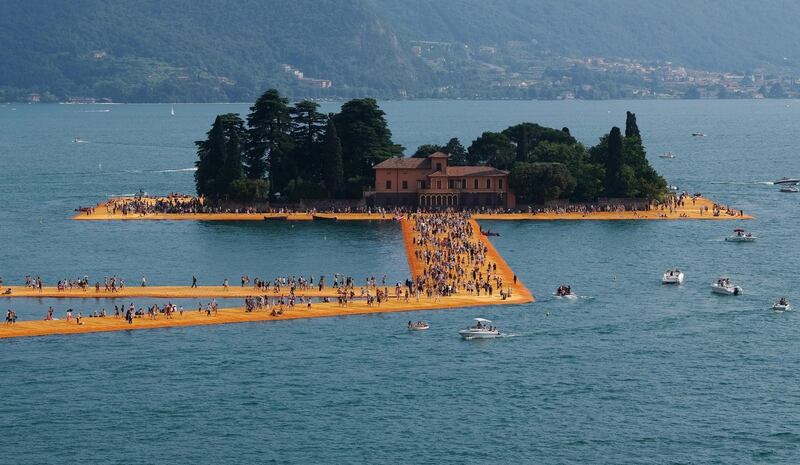 Christo and Jeanne-Claude: people walking on The Floating Piers, on Lake Iseo, in Italy, in 2016. Photograph: Filippo Venezia/EPA