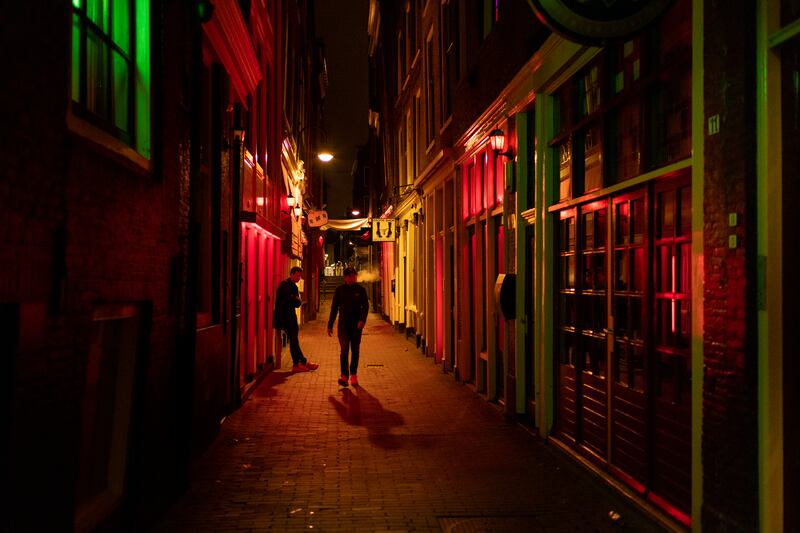 The red light district in Amsterdam. The city is looking to set up legal prostitution elsewhere. Photograph: Ilvy Njiokiktjien/The New York Times
                      