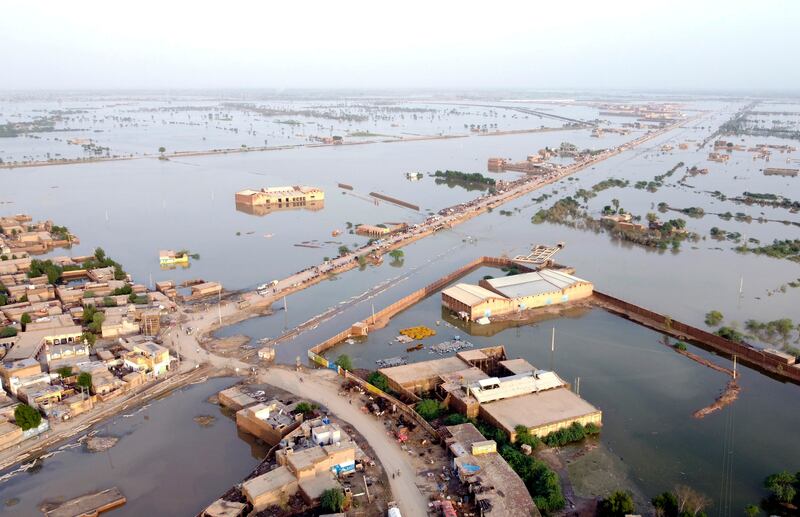 Homes surrounded by floodwaters in Sohbat Pur city of Jaffarabad, a district of Pakistan’s southwestern Baluchistan province. Photograph: Zahid Hussain/AP