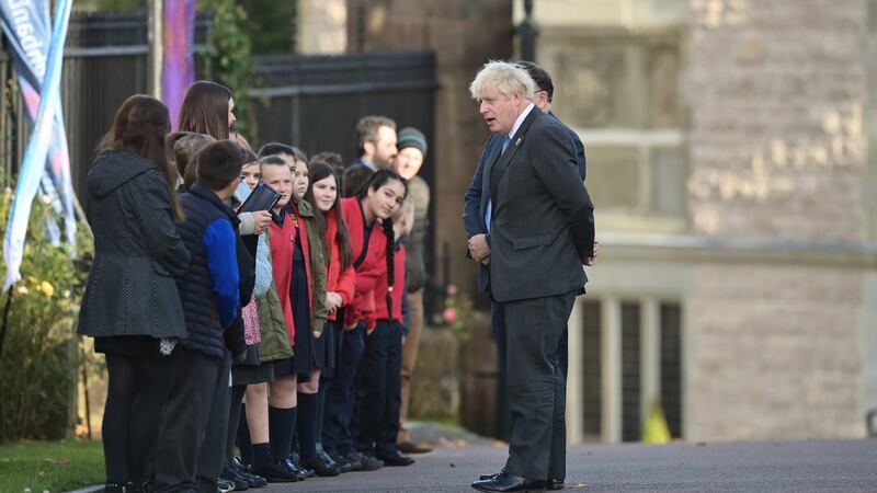 British prime minister, Boris Johnson is greeted by schoolchildren as he arrives  at St Patrick’s  Church of Ireland cathedral  in Armagh. Photograph: Charles McQuillan/Getty Images