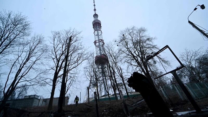 A fireman walks past fragments of missile after a Russian airstrike hit Kyiv’s main television tower. Photograph: Sergei Supinsky/AFP