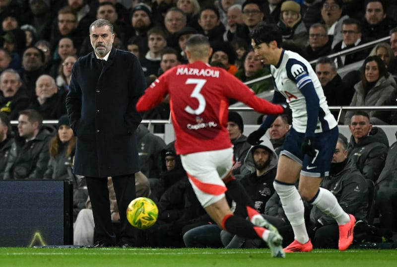 Tottenham Hotspur's Greek-Australian Head Coach Ange Postecoglou watches the players from the touchline during the English League Cup quarter-final football match between Tottenham Hotspur and Manchester United at the Tottenham Hotspur Stadium in London, on December 19, 2024. (Photo by Ben STANSALL / AFP) / RESTRICTED TO EDITORIAL USE. No use with unauthorized audio, video, data, fixture lists, club/league logos or 'live' services. Online in-match use limited to 120 images. An additional 40 images may be used in extra time. No video emulation. Social media in-match use limited to 120 images. An additional 40 images may be used in extra time. No use in betting publications, games or single club/league/player publications. /  (Photo by BEN STANSALL/AFP via Getty Images)