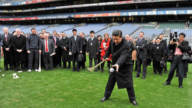 Xi Jinping tries his hand at hurling in  Croke Park during his visit to Ireland . Photograph: Brendan Moran/Sportsfile