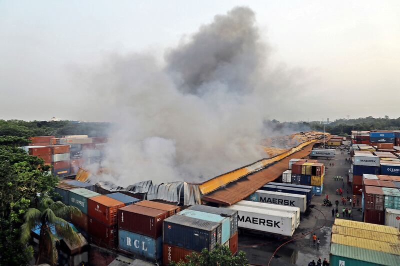 Smoke billowing after the fire broke out at the container storage facility in Sitakunda, about 40km (25 miles) from the key port of Chittagong