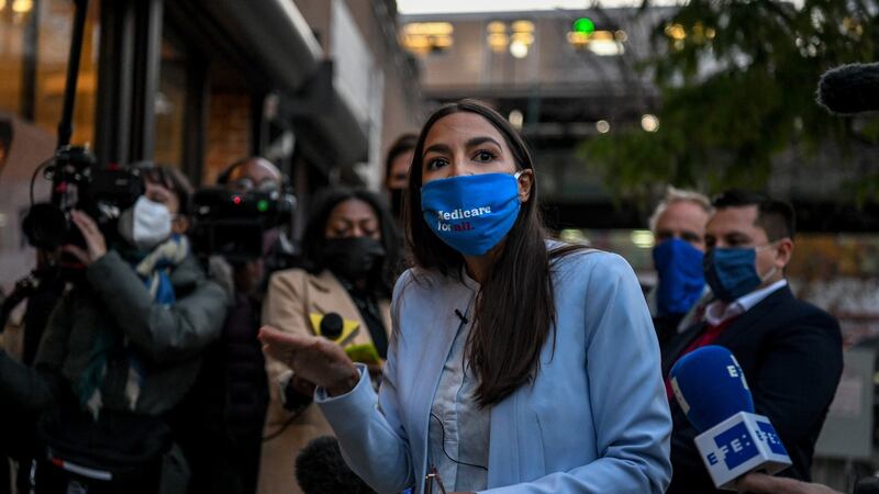 Alexandria Ocasio-Cortez of New York speaks to volunteers and staff outside of her campaign office in the Westchester Square neighbourhood of the Bronx. Photograph: Desiree Rios/The New York Times