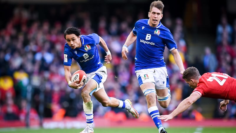 Ange Capuozzo steps around Kieran Hardy on his way to setting up Italy’s match-winning try. Photograph: Andy Watts/Inpho