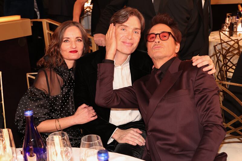 Oppenheimer: Cillian Murphy with his wife, Yvonne McGuinness, and his costar Robert Downey jnr at the Golden Globe Awards in January. Photograph: Christopher Polk/GG2024 via Getty