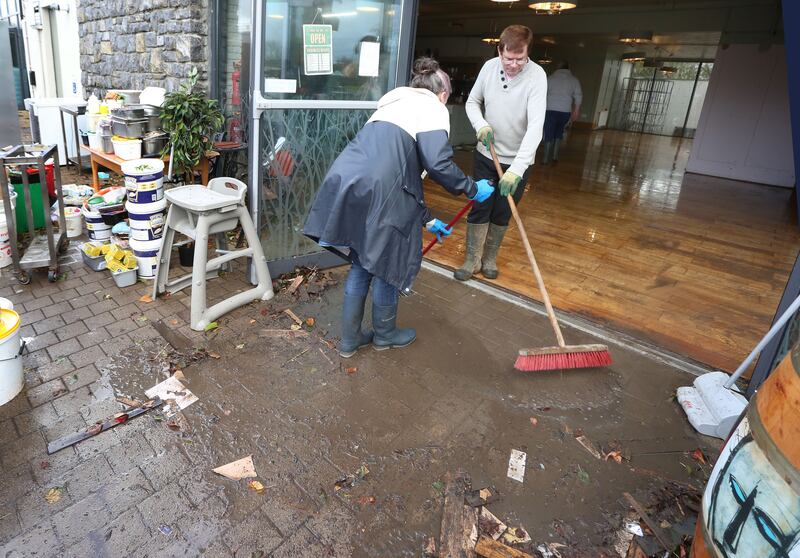 Staff and locals during the clean-up of the Poppyseed Cafe in Clarinbridge, Co Galway, which was flooded during Storm Debi. Photograph: Joe O'Shaughnessy